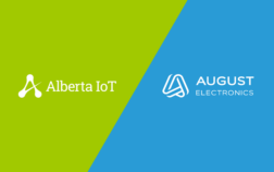 Split image showing two logos on a diagonal background. The left side, with a bright green background, displays the Alberta IoT logo in white. The right side, with a blue background, features the August Electronics logo in white.