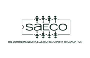 Logo of the Southern Alberta Electronics Charity Organization (SAECO), featuring the text 'SAECO' in the center, surrounded by a series of simplified human figures holding hands in a circle. The full name of the organization is written below the logo.